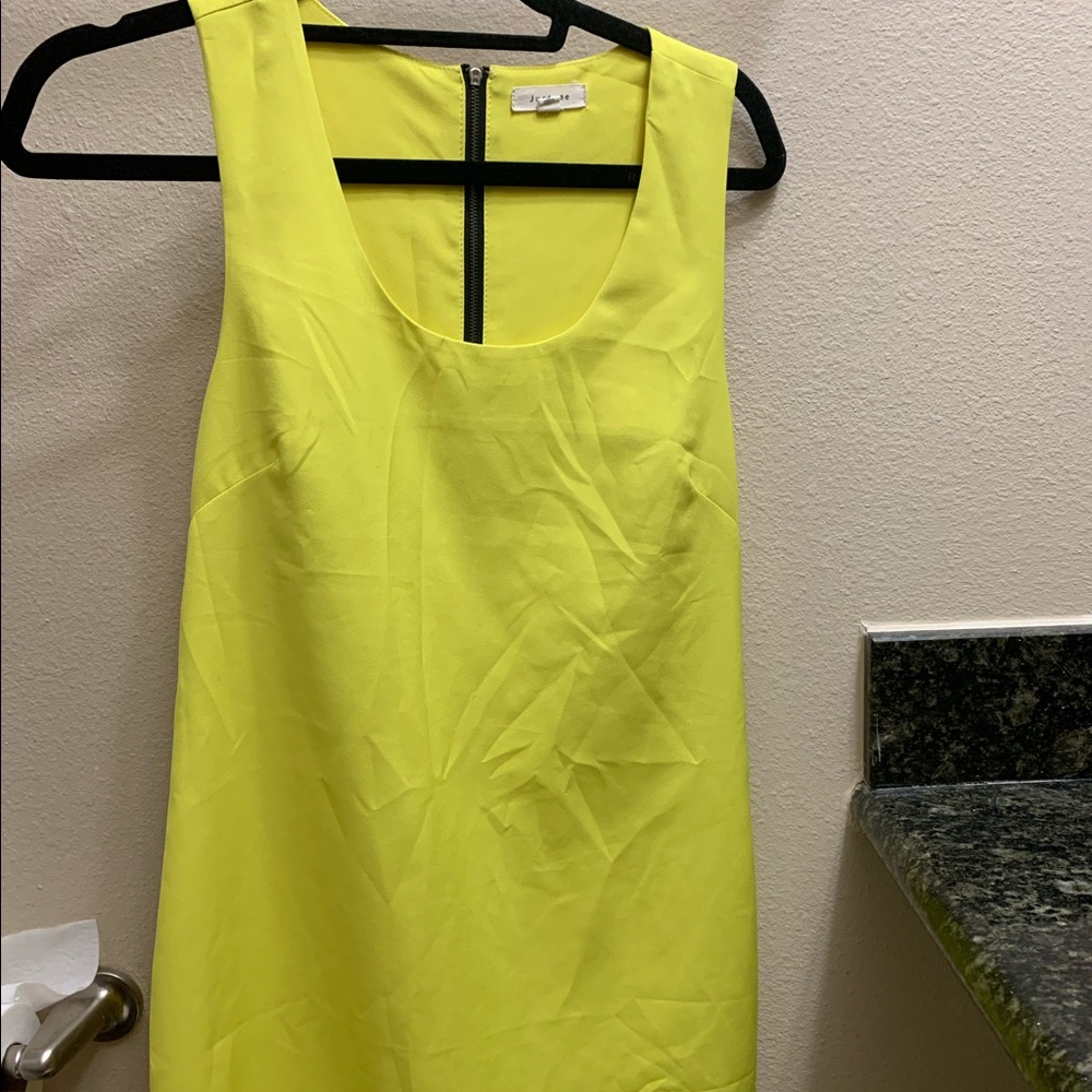 Adorable yellow dress with an open back
